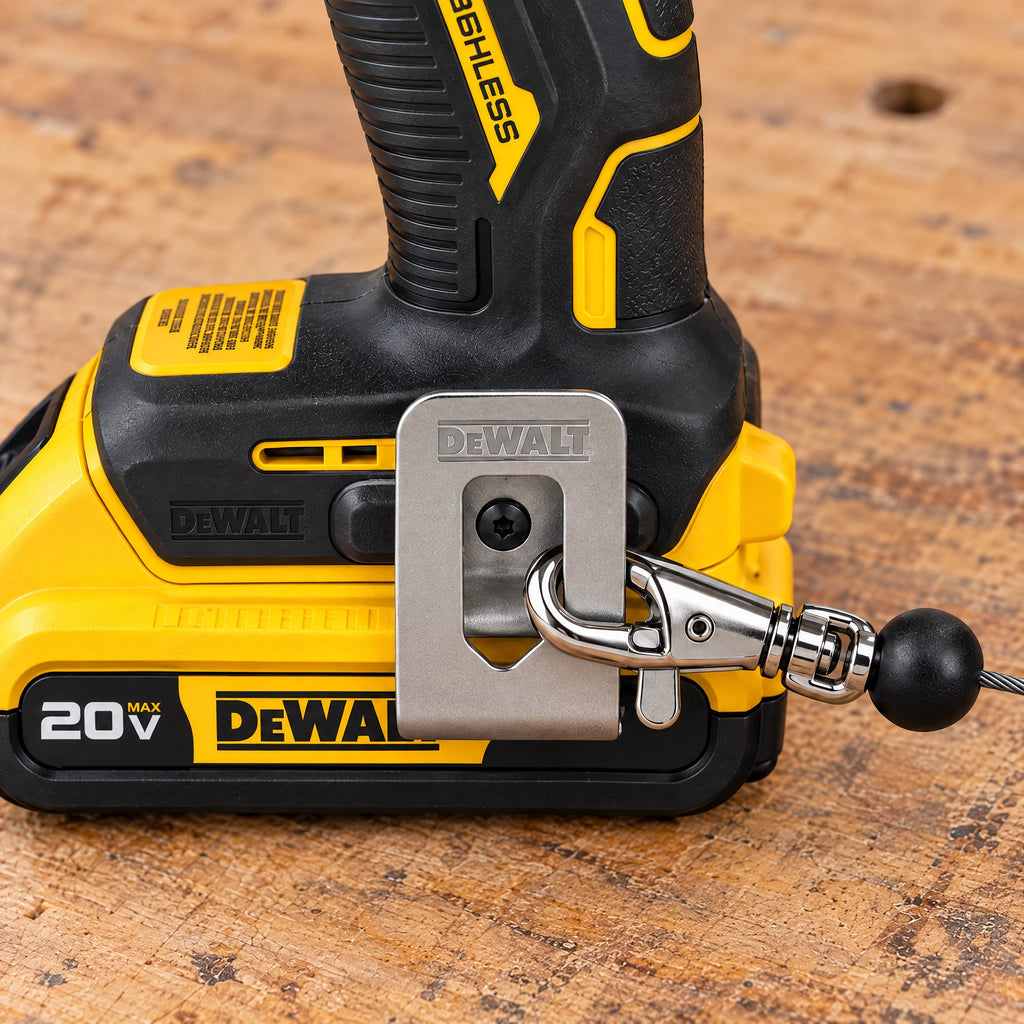 Chrome hook clipped onto the side of a drill's belt hook beside the battery
